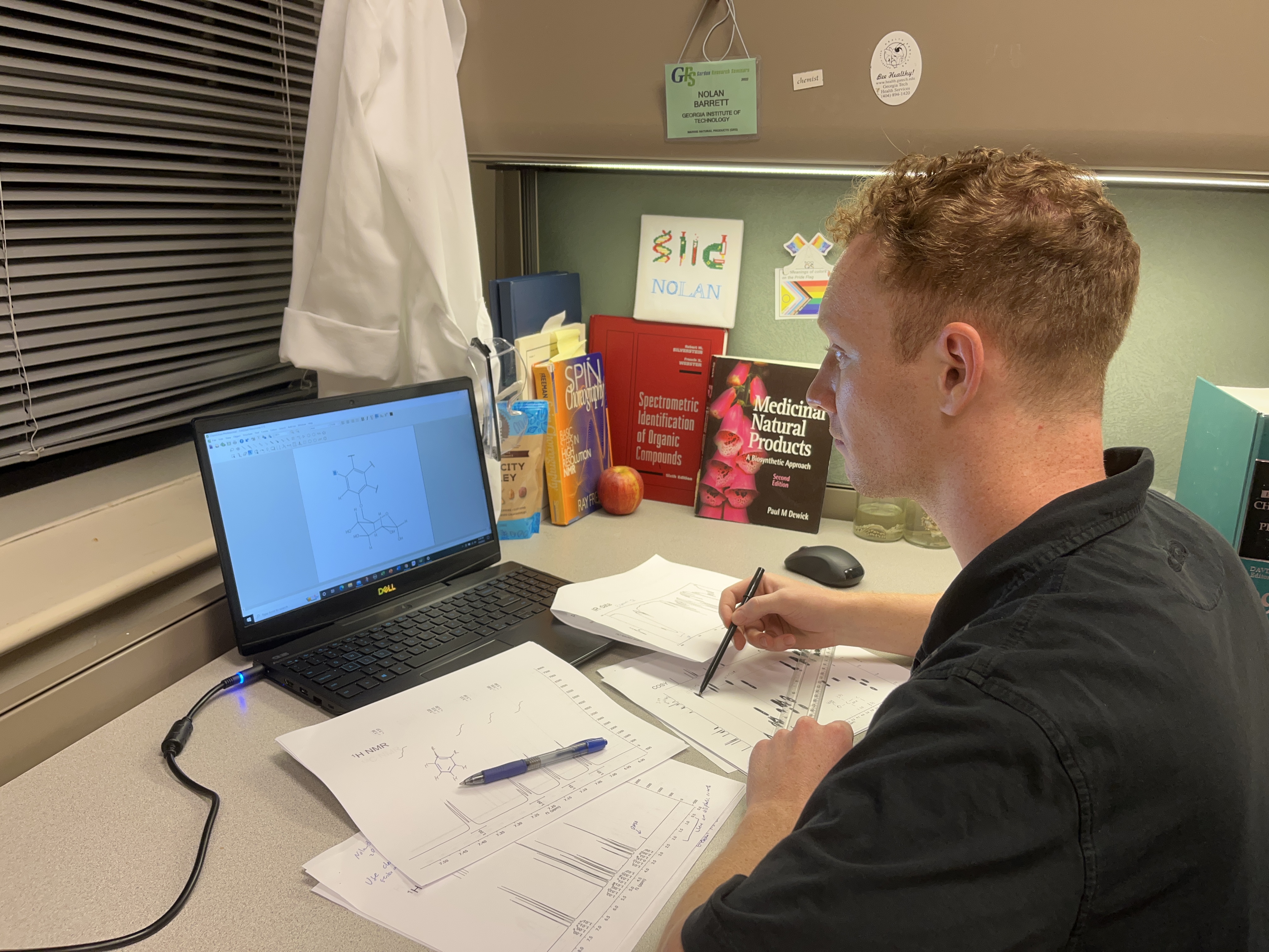 Nolan Barrett studying chemistry at a laptop.